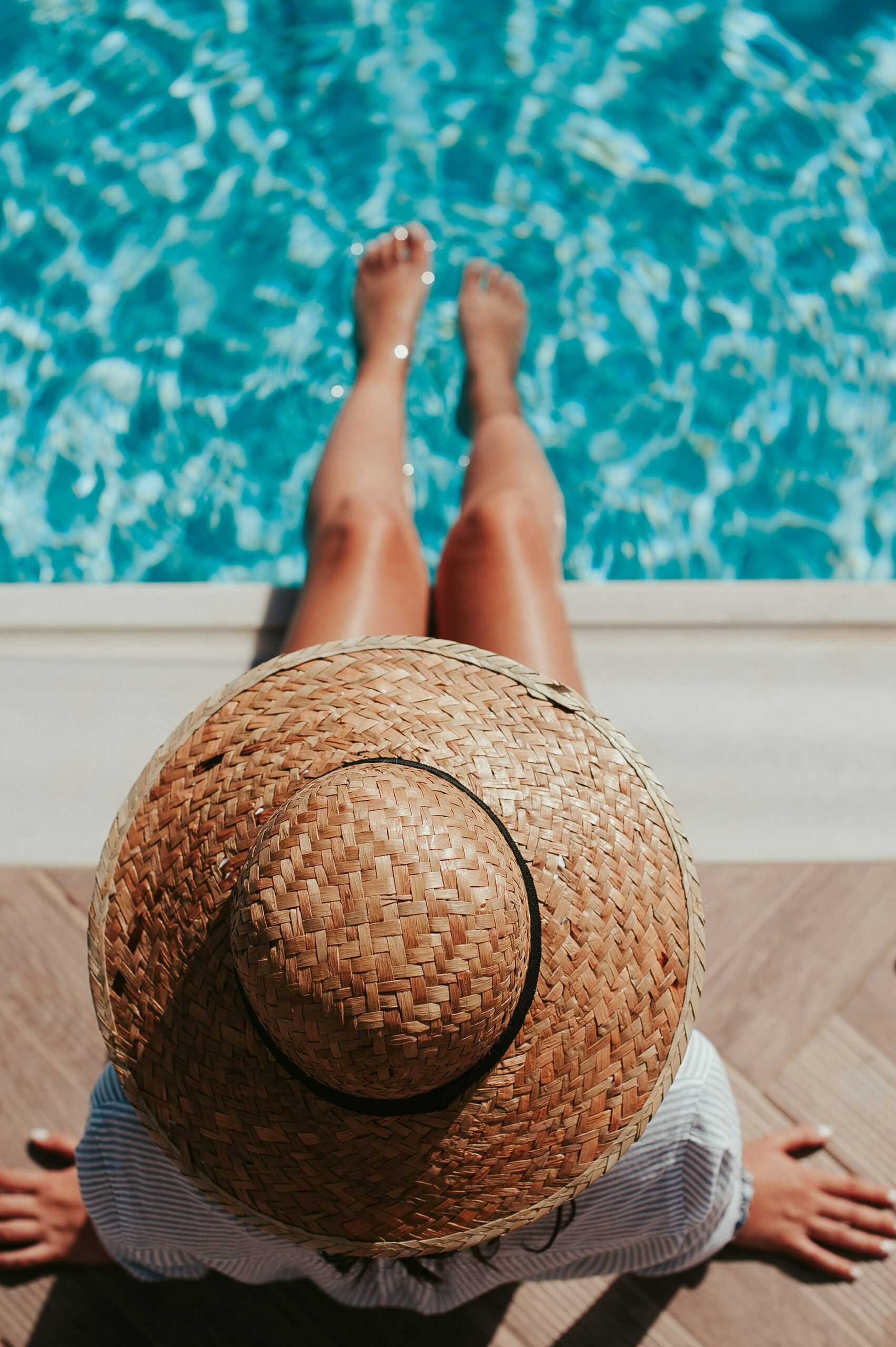 Sunbathing by the pool in resort casual attire