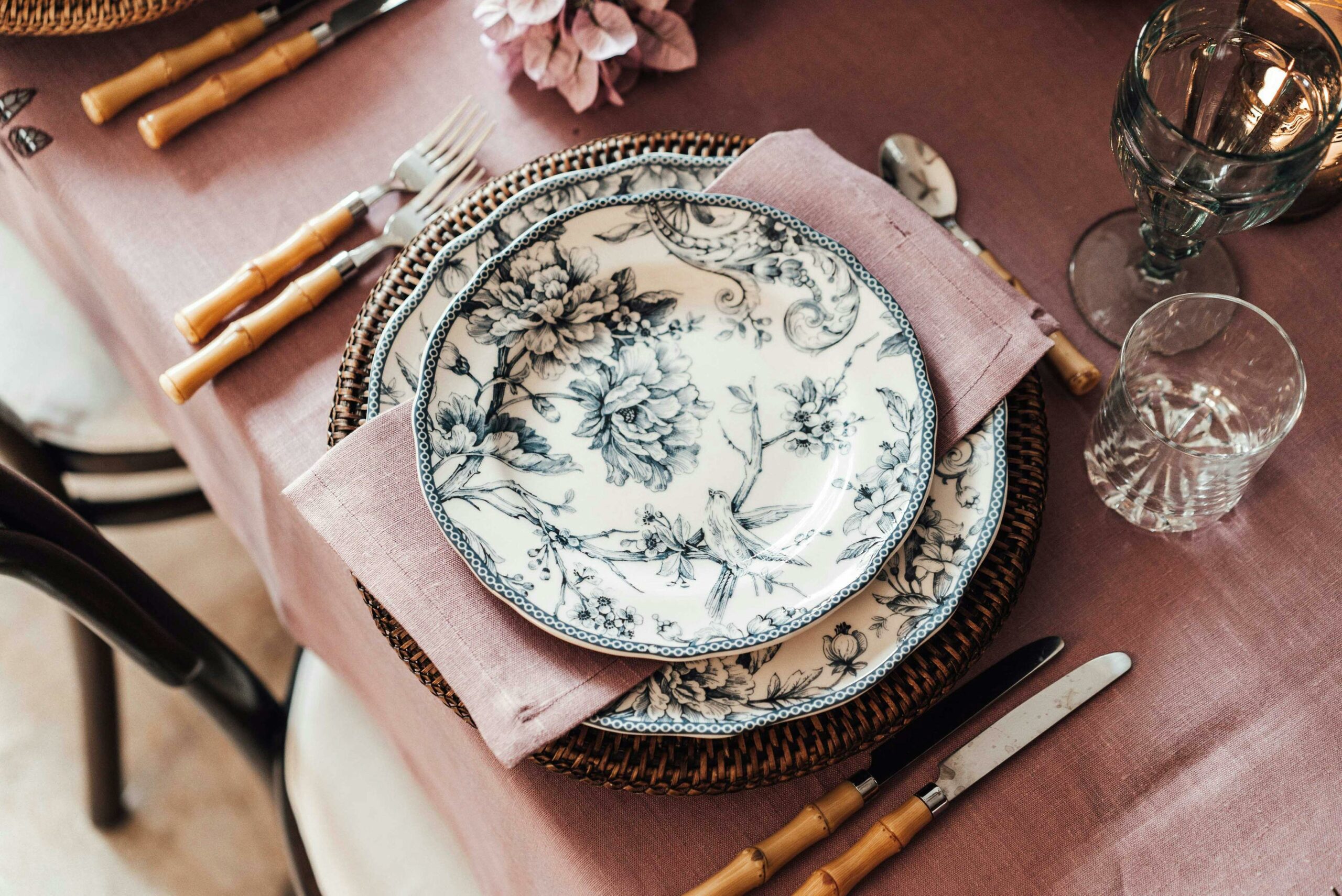 beautiful rose and green color tablescape decor, with bamboo cutlery