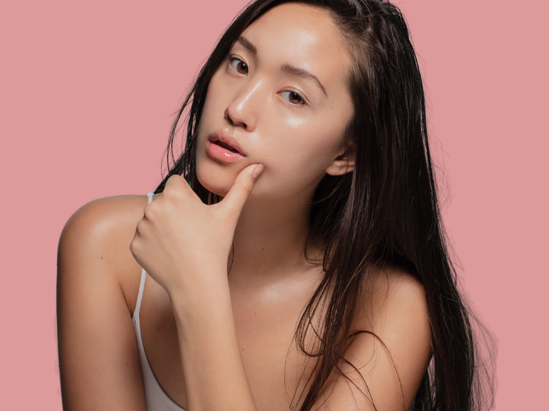 Asian woman looking into the camera. Hair porosity type, texture and density